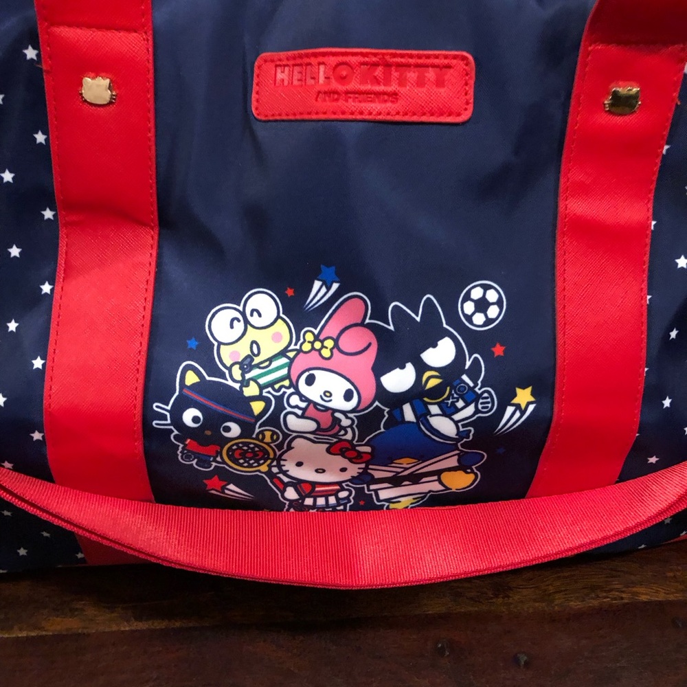 Hello Kitty & Friends Rolling Duffel Bag Navy Red Stars Carry On Luggage Wheels - Picture 2 of 13